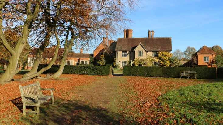 The house and rear garden in autumn at Packwood House, Warwickshire